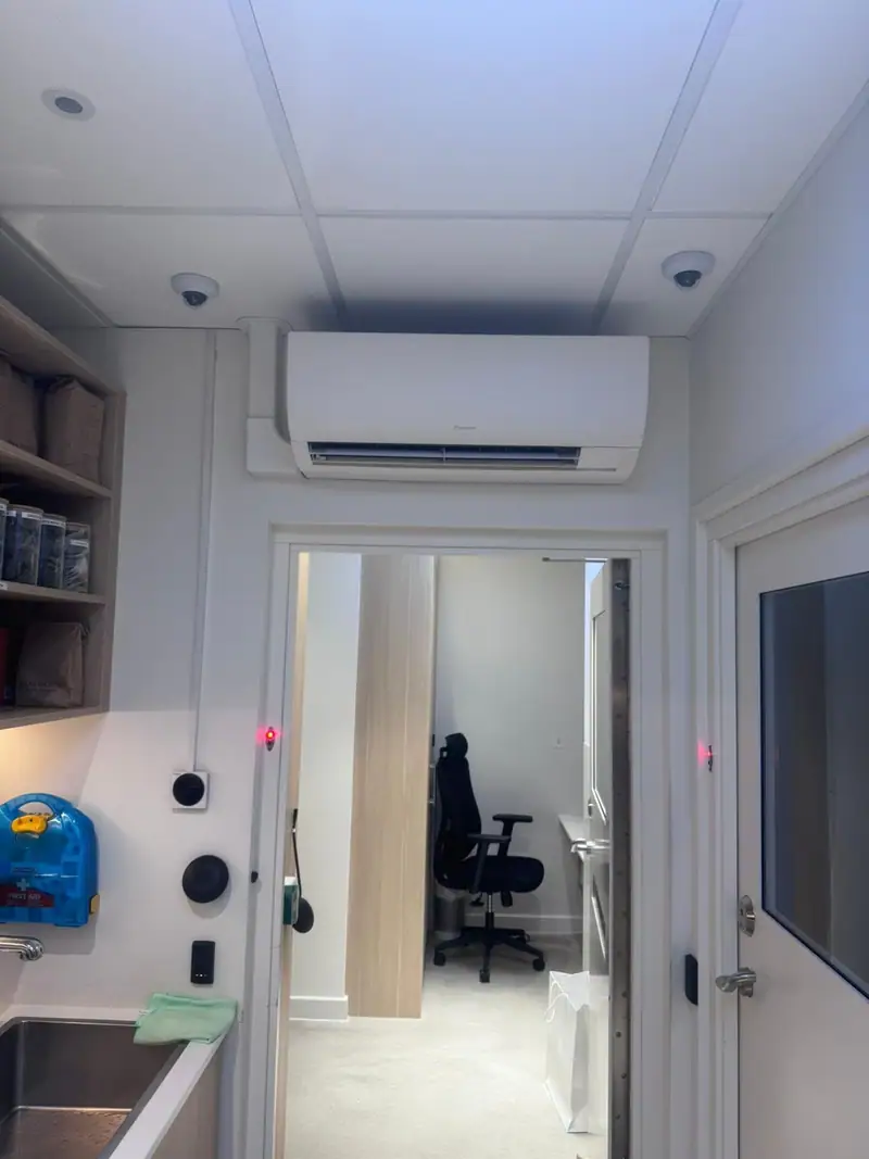 Wall-mounted indoor unit in a back-of-house room