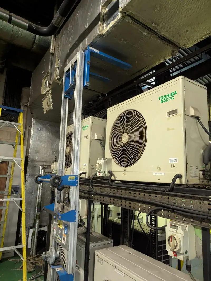 Outdoor condensing unit on a steel frame in a plant area