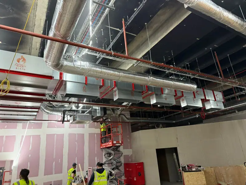 Ductwork and pipework at first fix across the open shop floor